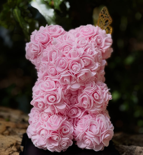 25cm Pink Rose Bear with butterfly detail displayed next to MB Experience gift box