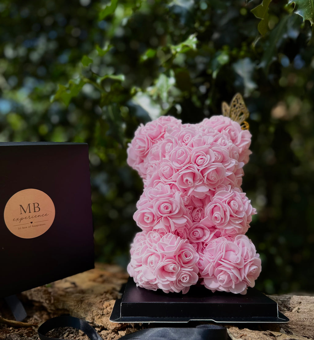 Close-up of 25cm Pink Rose Bear showing handcrafted foam roses and gold butterfly detail