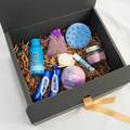 Me Time Box — luxury self-care gift box with lavender bath fizzer, Blue Wave shower gel, scented candle, lip balm, scalp massager and Milky Way treats